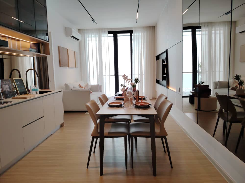Open plan living, dining and kitchen with floor-to-ceiling windows