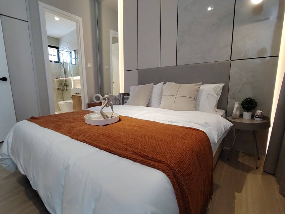 Master bedroom with marble-look headboard feature wall